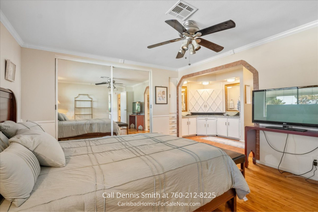 Primary bedroom inside Vista CA mobile home for sale with comfortable layout and storage...