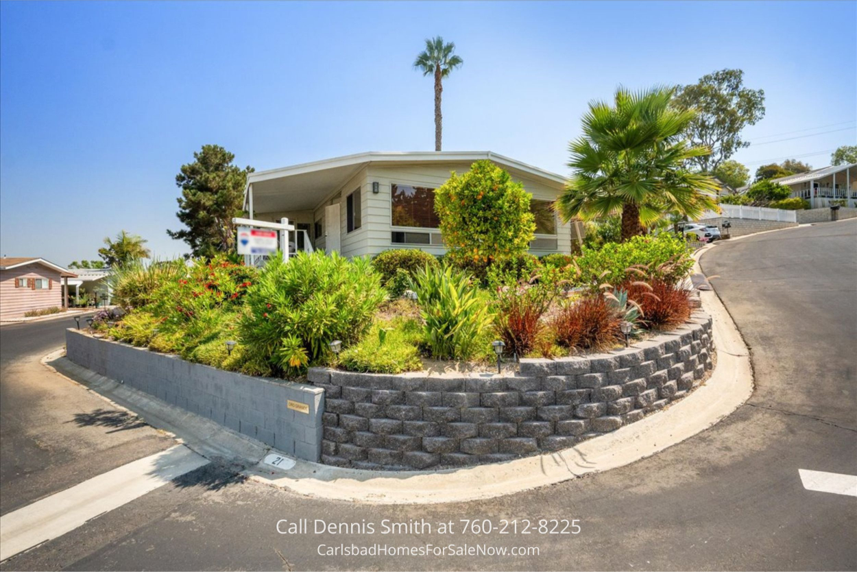 Exterior view of 2130 Sunset Drive SPC 21 Vista CA mobile home with covered parking and private entry...